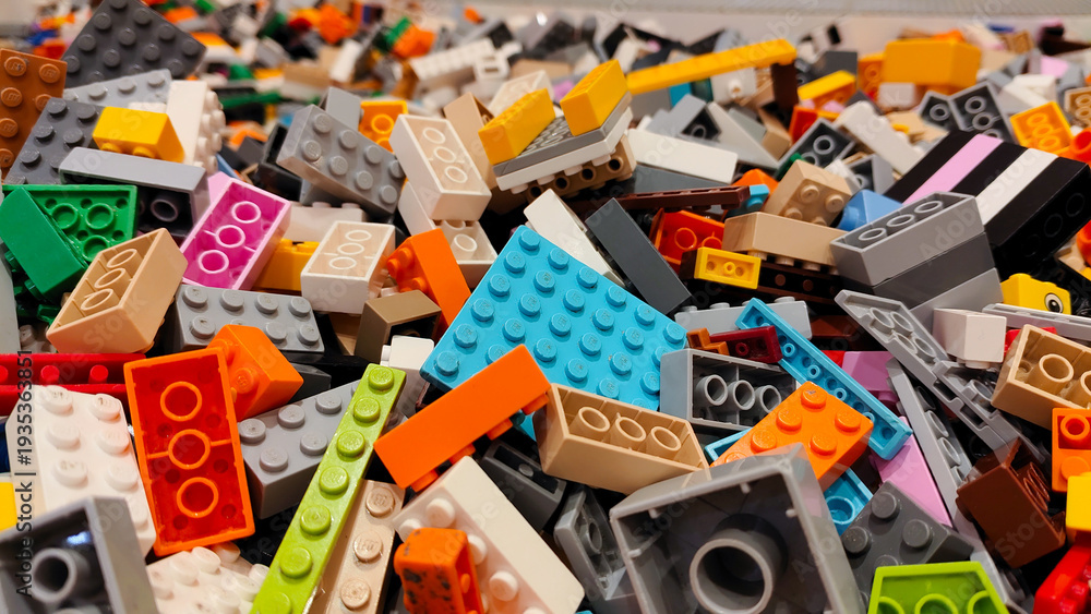 Fototapeta premium High angle view of a massive pile of colorful LEGO plastic building bricks and toy blocks in various shapes and sizes on September 15, 2025 in Bangkok, Thailand.