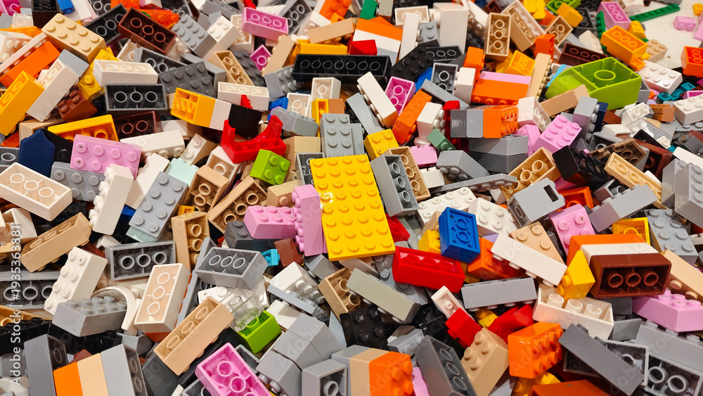 Obraz premium Close up top view of various colorful LEGO plastic building bricks and toy blocks in different shapes and sizes on September 15, 2025 in Bangkok, Thailand.
