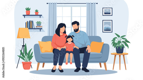 Portrait of a happy father, mother, and young daughter sitting together on a grey sofa in a modern and comfortable home interior.