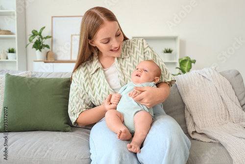 Beautiful young mother with...