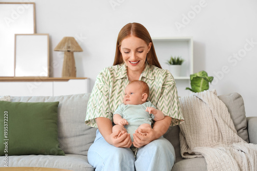 Beautiful young mother with...