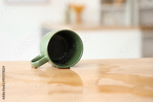 Overturned cup and spilled ...