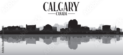 Black and white panoramic poster of the city skyline with misty background buildings and water reflection of CALGARY, CANADA
