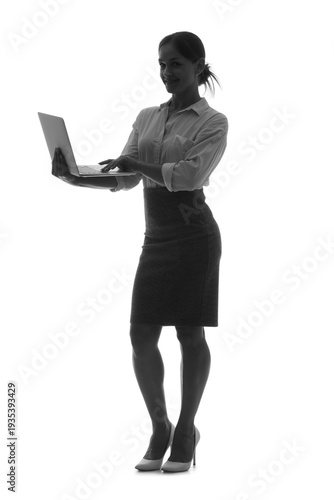 Silhouette of businesswoman working with laptop on white background