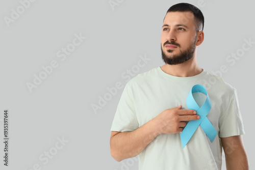 Young man with blue ribbon ...