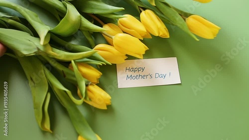 vibrant yellow tulip flowers with green leaves arrangement