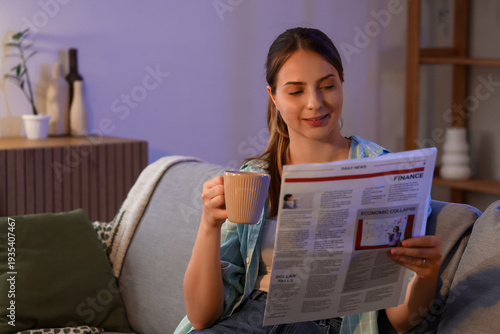 Young woman with cup of tea...