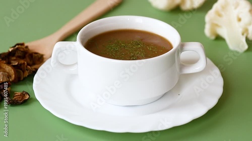 homemade mushroom soup with dried mushrooms garnish