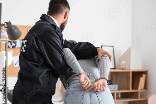 Male police officer with ha...
