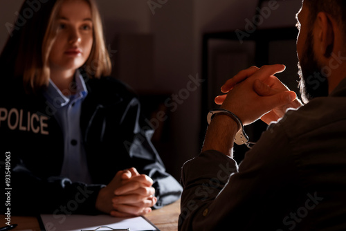 Man with handcuffs and dete...