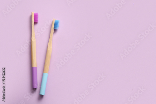 Wooden toothbrushes on lila...