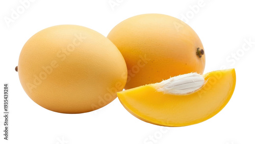 Fotografie Isolated yellow marian plum whole and sliced for healthy cooking, fresh fruit sn