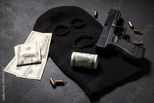 Balaclava with gun, money a...
