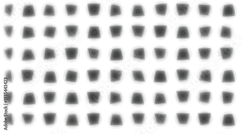 Blurry black dots arranged in a grid pattern on a white surface with subtle gradient effects