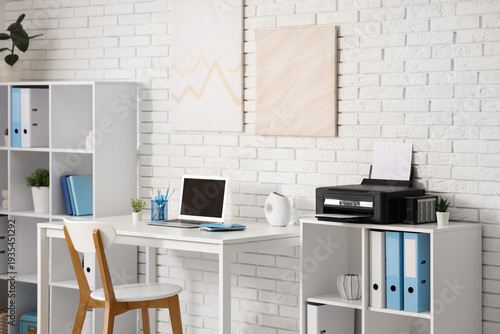 Stylish workplace with mode...
