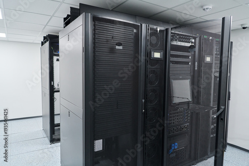 Modern data center server racks and network equipment in a secure, climate-controlled server room