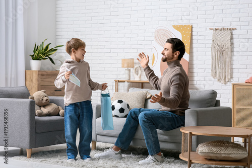 Man and his little son play...