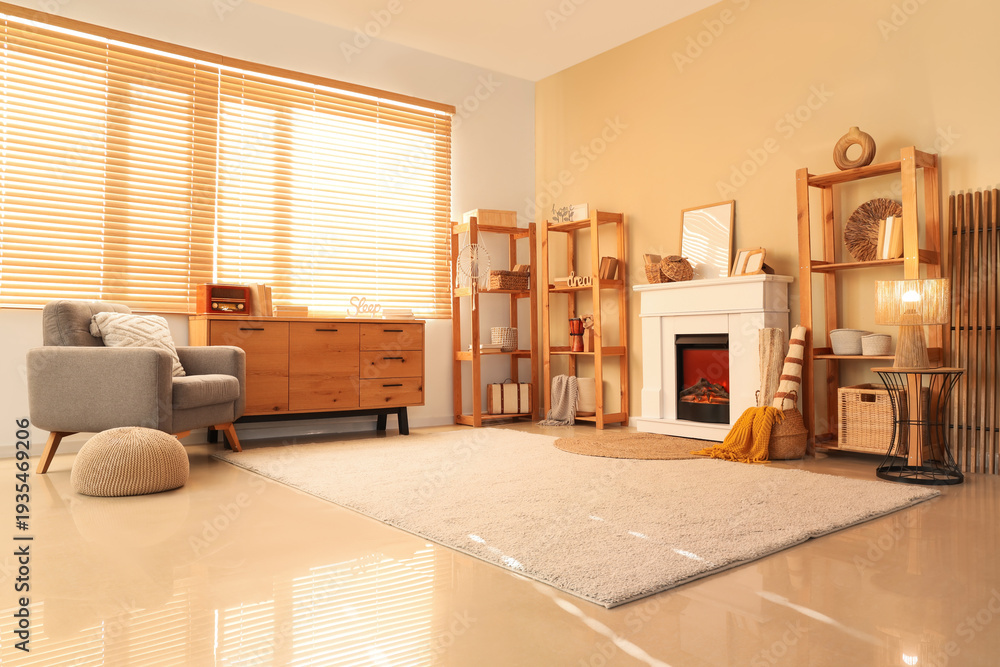 Naklejka premium Interior of cozy living room with fireplace, armchair and shelving units