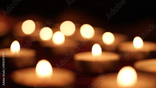 Warm candlelight bokeh with shallow depth of field, cozy atmosphere background