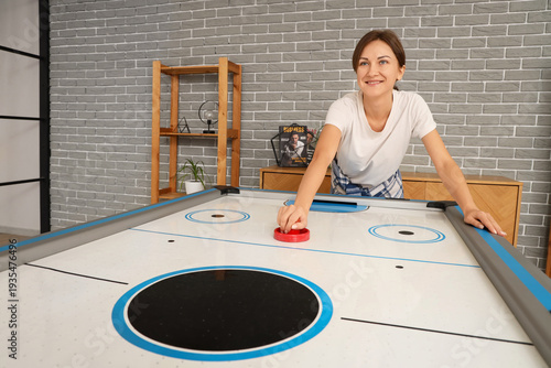 Young woman playing air hoc...