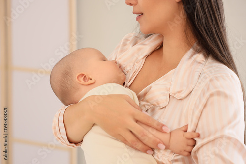Mother with her sleeping ba...