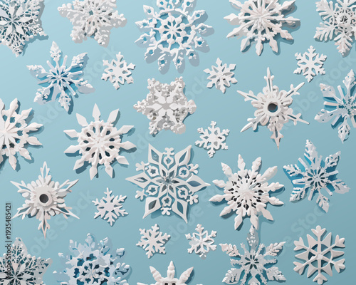Assorted paper snowflakes scattered across a light blue background