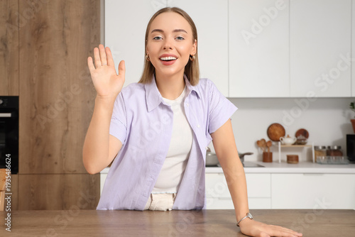 Young woman video chatting ...