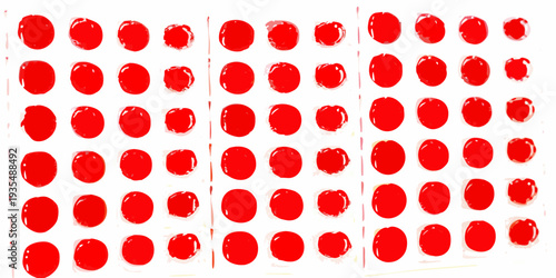 Arrangement of vibrant red circular dots on a white background
