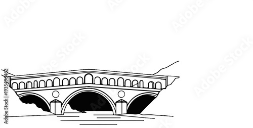 Historic stone bridge with multiple arches spanning a river, set against a backdrop of hills