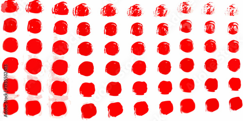 Arrangement of red circular ink blots against a white background
