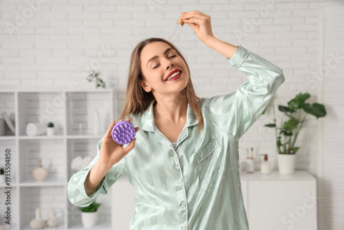 Young woman in pajamas with...