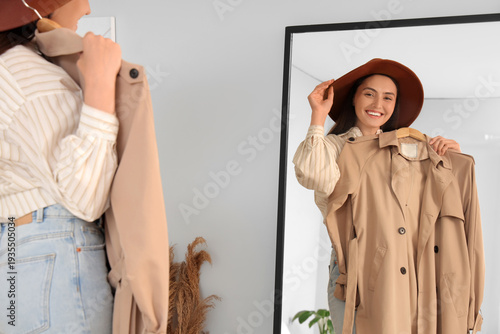 Young woman trying on styli...