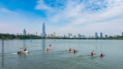 Kayaks on Xuanwu Lake in Nanjing, with the Zifeng Tower in the background.