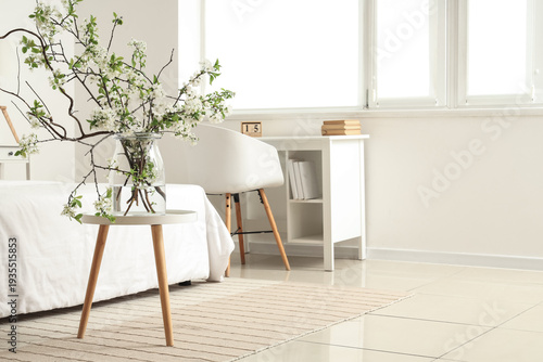 Vase with blooming branches...