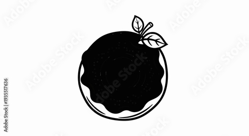 Black donut with white icing drips and two green leaves on top