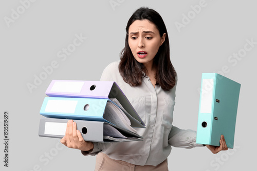 Sad young businesswoman wit...