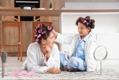 Little Asian girl and her m...