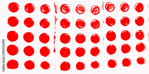 Arrangement of red textured circles on a white background