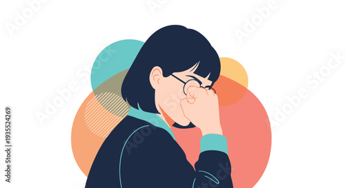 Distressed young woman with short hair suffers from a headache and rubs her forehead against a background of bright colorful circles.