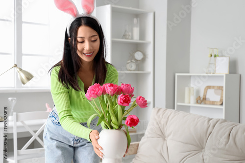 Young Asian woman in bunny ...