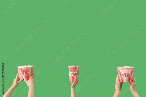 Hands holding buckets with ...