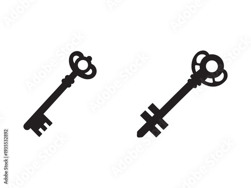 Two antique skeleton keys with ornate handles and teeth  isolated on white background