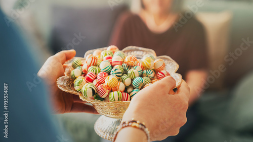 Visiting relatives and offering candy during Eid al-Fitr celebration