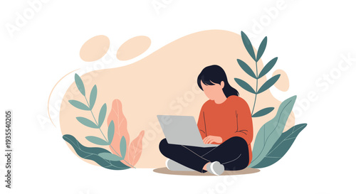 Young woman sitting cross legged on the floor while working on her laptop surrounded by large green indoor plant leaves.