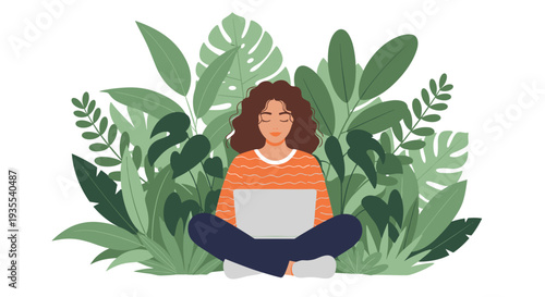 Calm woman sitting in a lotus position working on a laptop surrounded by lush green tropical leaves and plants.