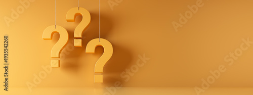 Three hanging white question marks in front of a yellow wall with copy space - 3D illustration