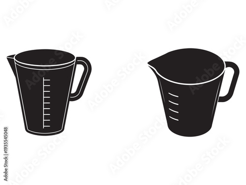 Two black measuring cups with handles one with measurement markings on side and one with slanted lines on body for accurate pouring and mixing isolated on white background