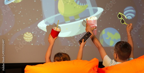 Cute children with popcorn ...