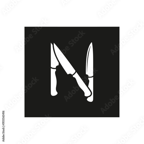 Graphic letter N shaped by two kitchen knives