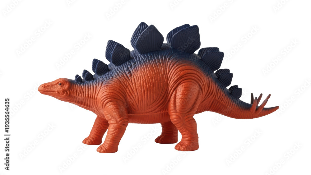 Fototapeta premium Isolated toy Stegosaurus dinosaur figure with orange and blue coloring, studio shot